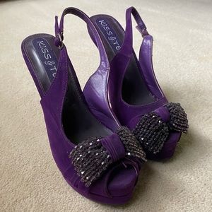 Purple 6” heel with sparkle bow. Size 8, adjustable strap